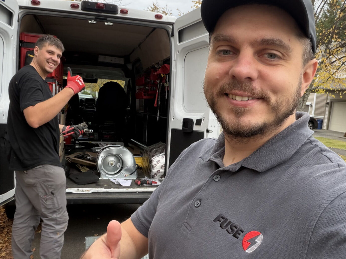 appliance repair carmel valley team beside the car