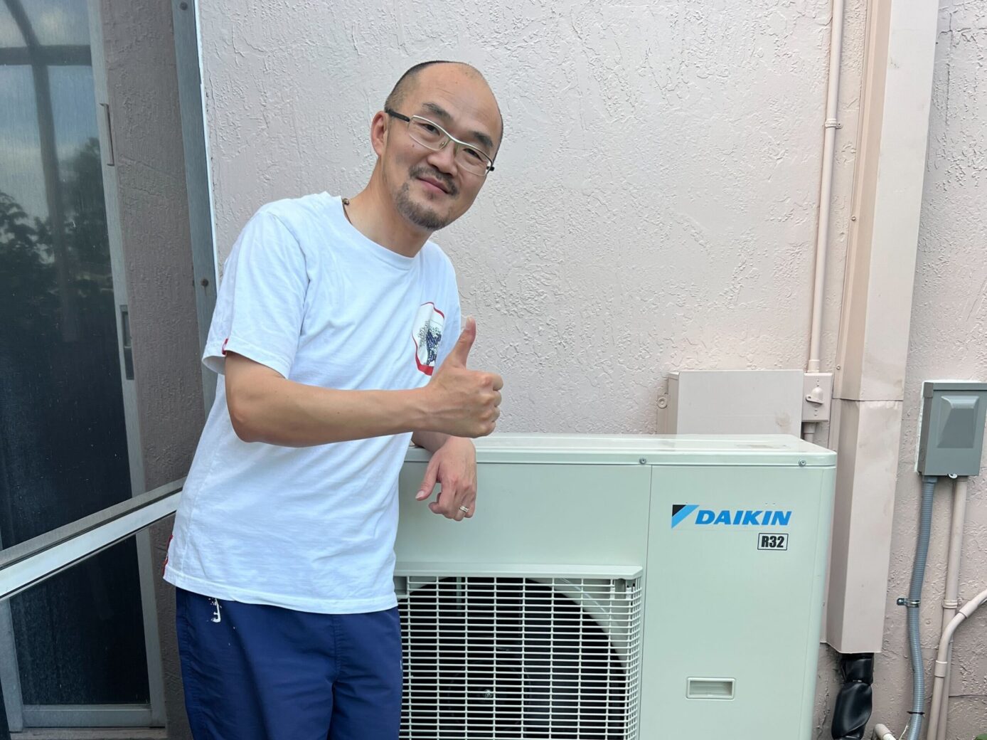Client standing next to hvac seaside ca