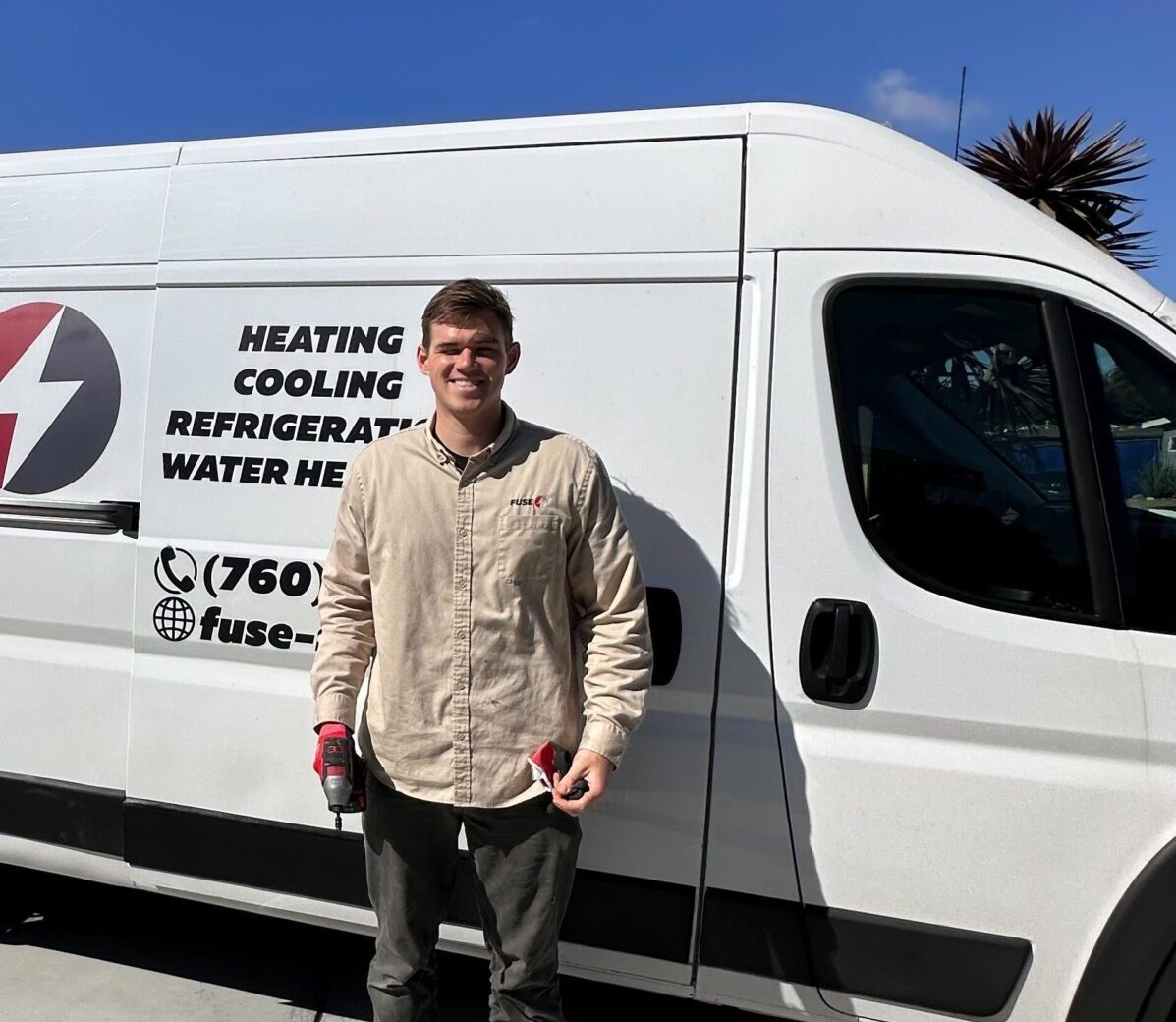 Fuse Monterey technician beside the car