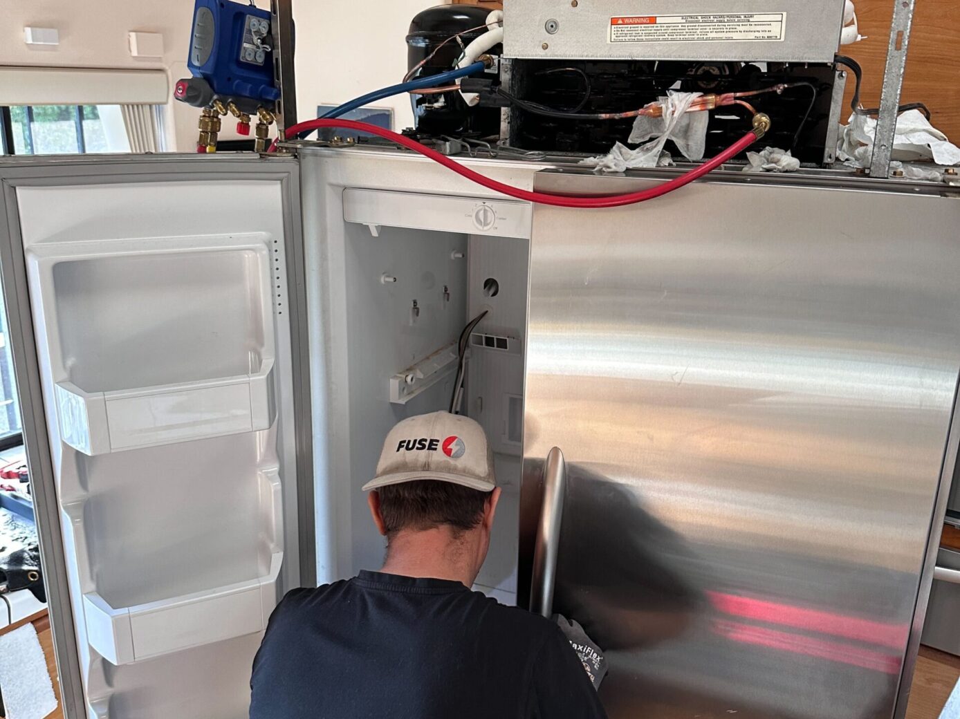 Technician doing refrigerator repair salinas
