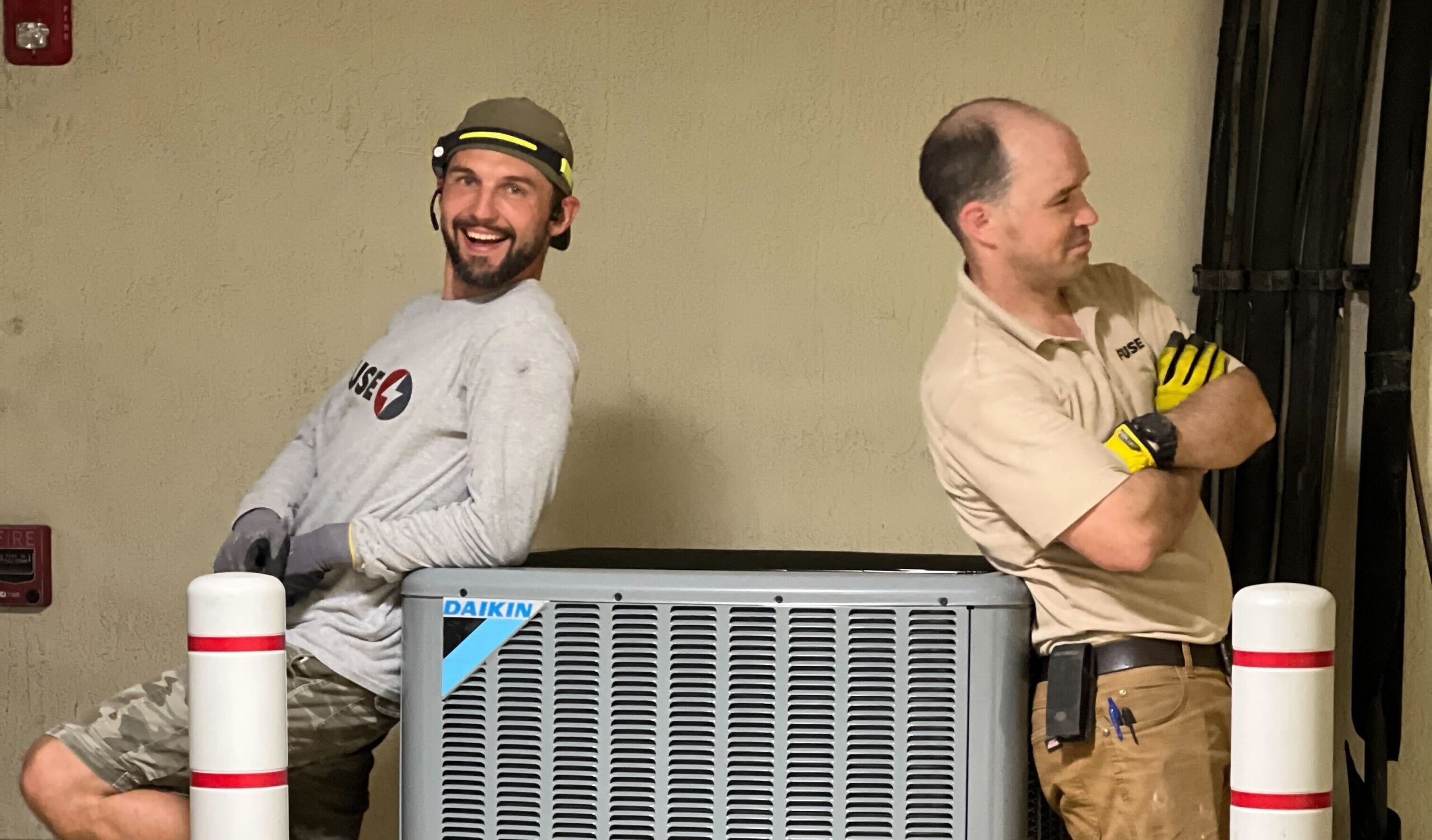 Technicians stand by appliance