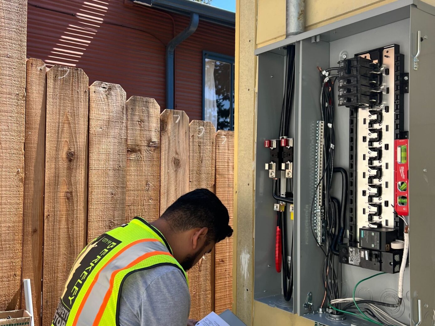 electrician diagnosing problem with wiring