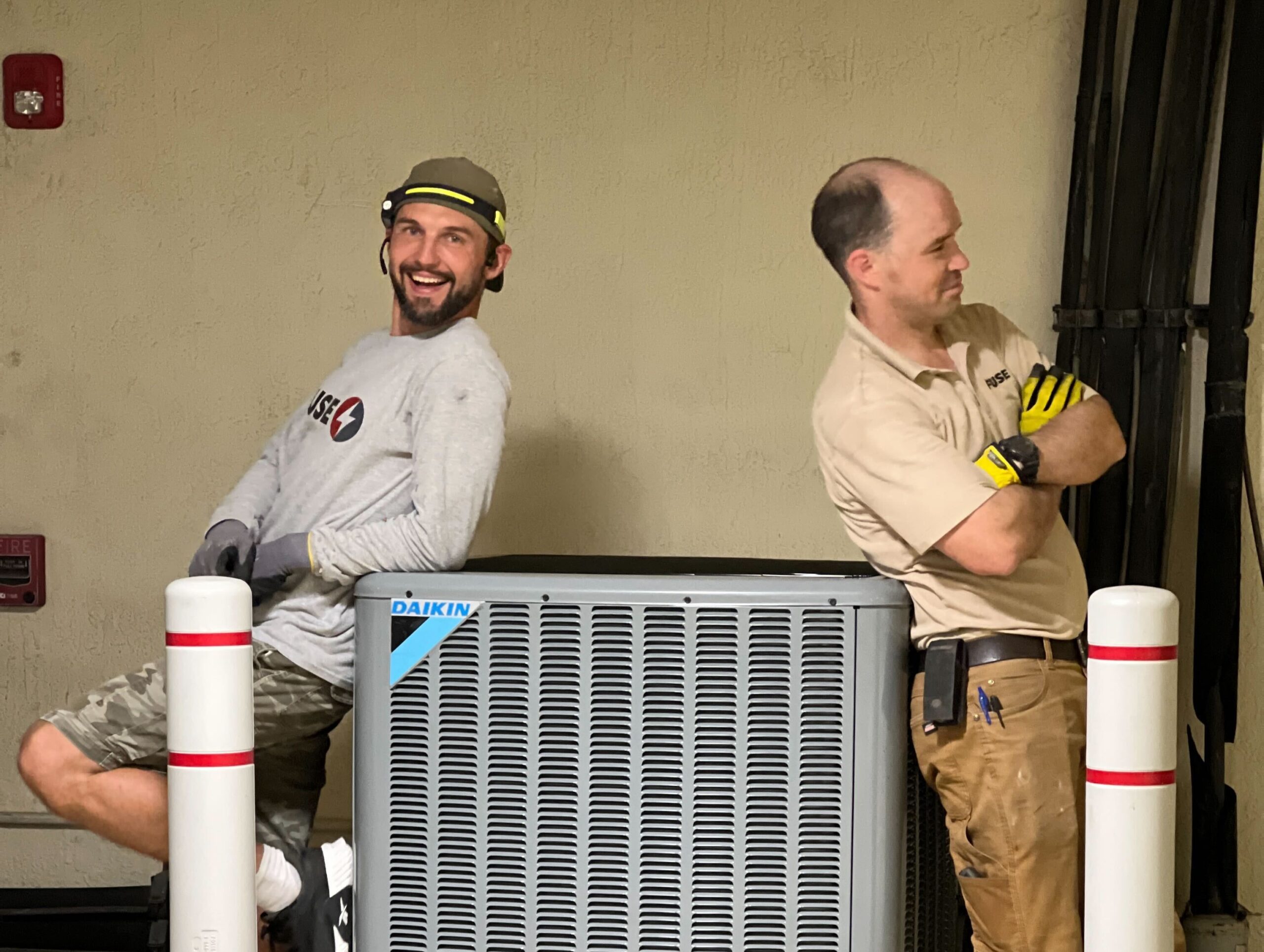 technicians standing beside heat pump salinas ca