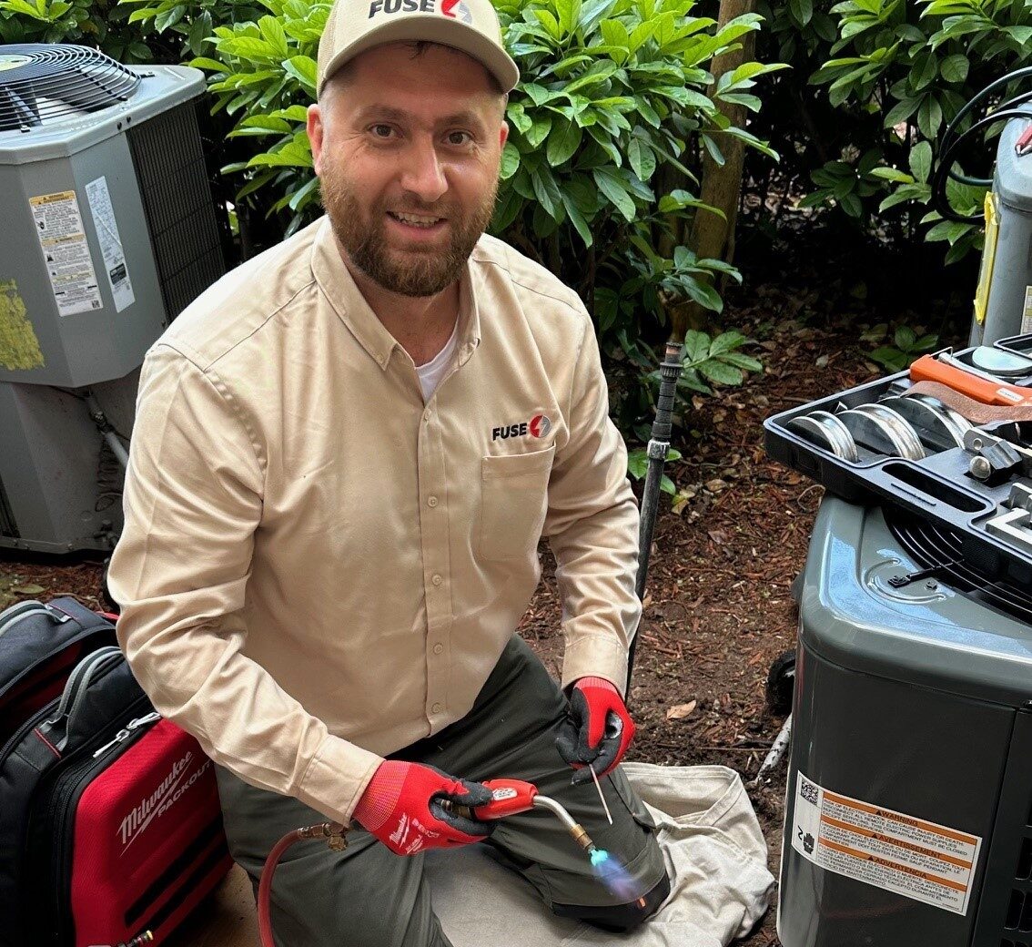 technician repairing heater