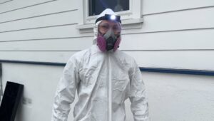 how much does it cost to replace ductwork: technician in the safety costume